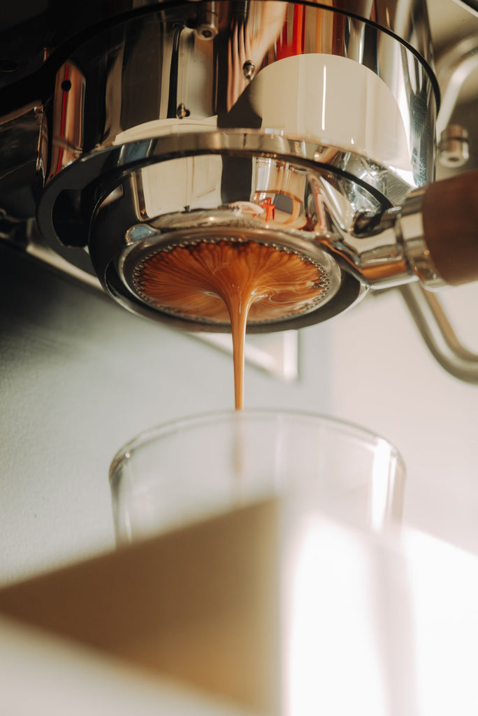 shot pulling with a bottomless portafilter bottom view lifestyle by clive coffee