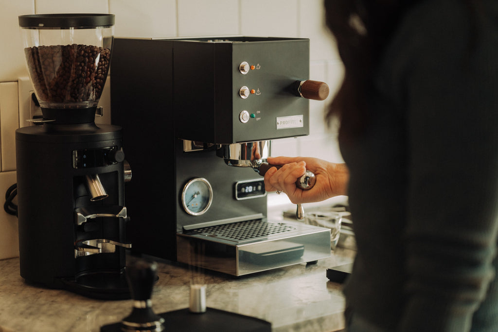 Mahlkönig X54 grinder in black and Profitec go espresso machine in black lifestyle by clive coffee