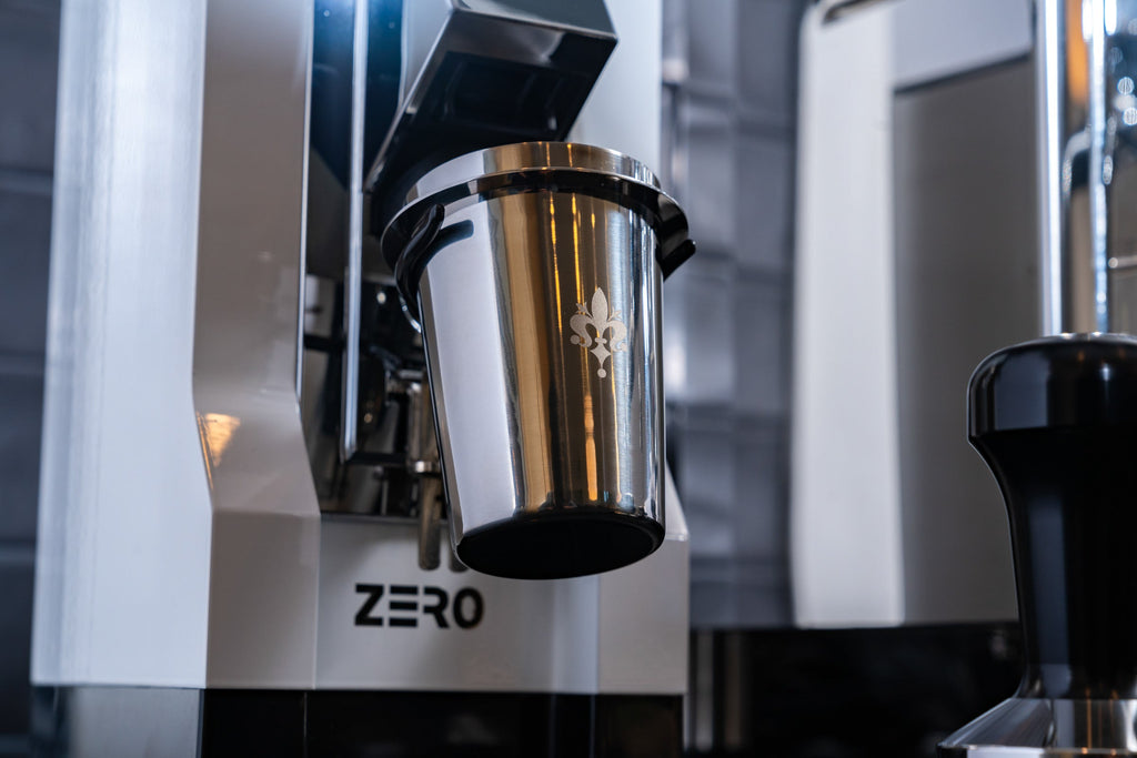 Eureka Mignon Zero Espresso Grinder in White Closeup on Dosing Cup Lifestyle by Clive Coffee