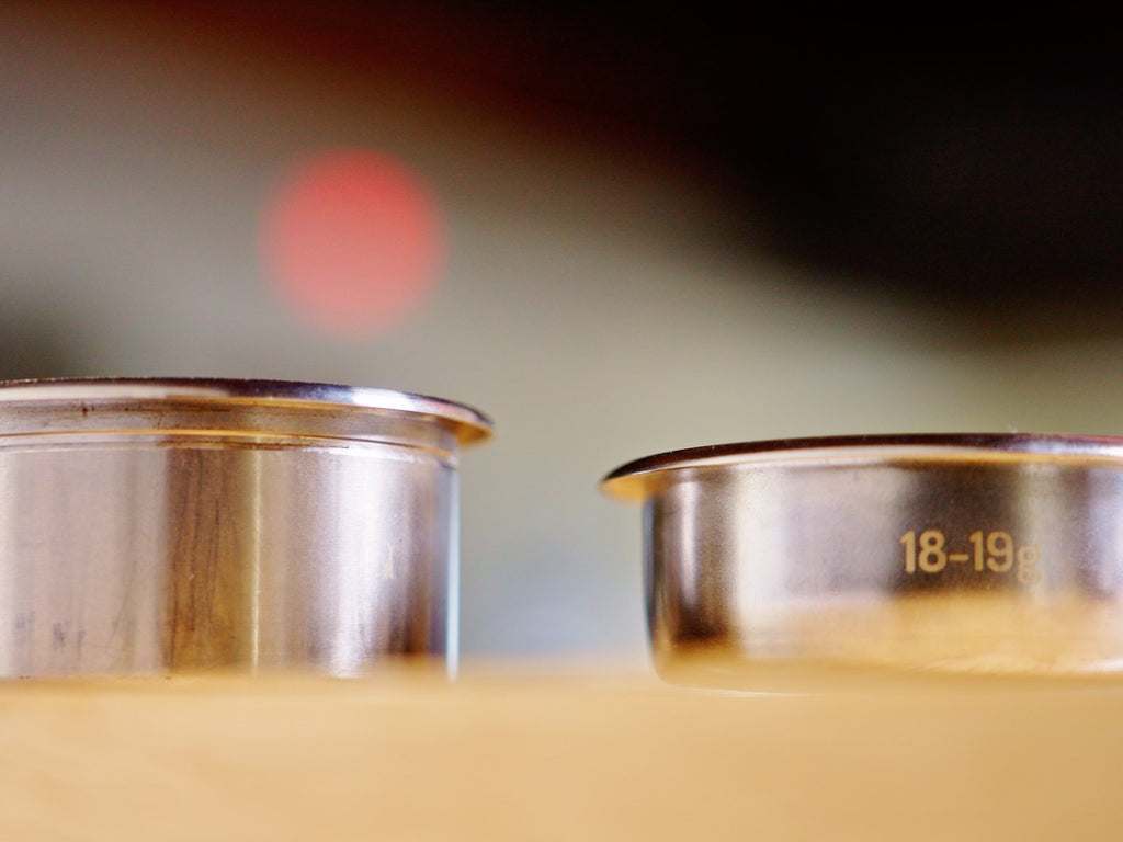 Two portafilter baskets side by side lifestyle by clive coffee