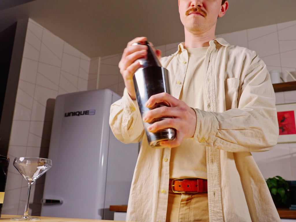 talent shaking a cocktail shaker lifestyle by clive coffee