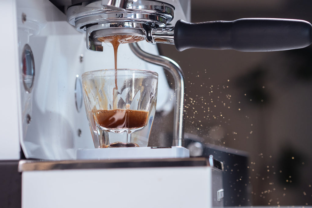 Shot pulling up close on a Linea Mini R espresso machine lifestyle by Clive Coffee